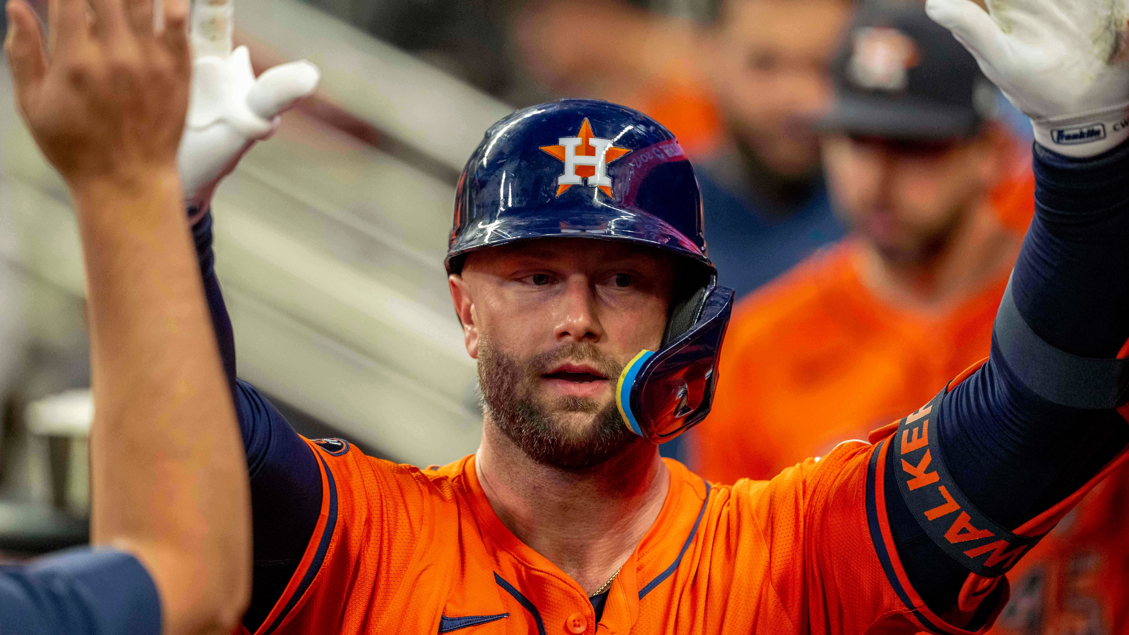 Houston Astros' Christian Walker (8) celebrates after scoring a run during the third inning of a baseball game against the Atlanta Braves, Saturday, Sept. 13, 2025, in Atlanta. (AP Photo/Erik Rank)