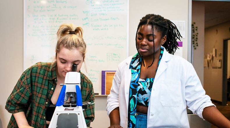 Fusion student Grace Neff and teacher/mentor Tolulope Babalola work in the Buckhead school's science lab.