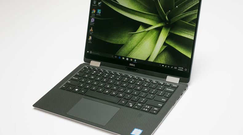 Despite a few trade-offs in ports and processing power, this slimmer hybrid version of the Dell XPS 13 is an excellent full-time laptop and part-time tablet. (Sarah Tew/CNET/TNS)