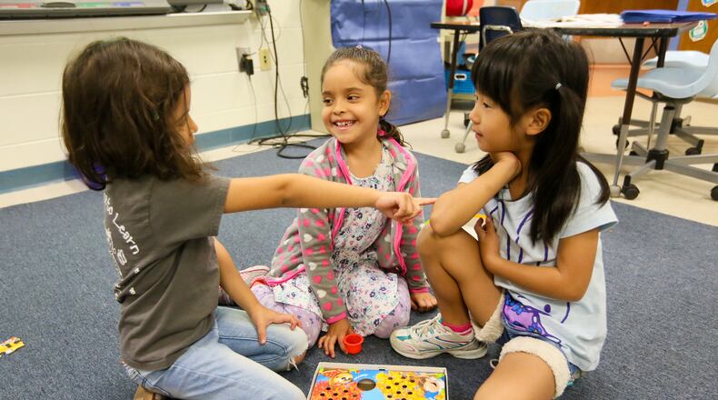 Students play games in English in a program for children learning English as their second language