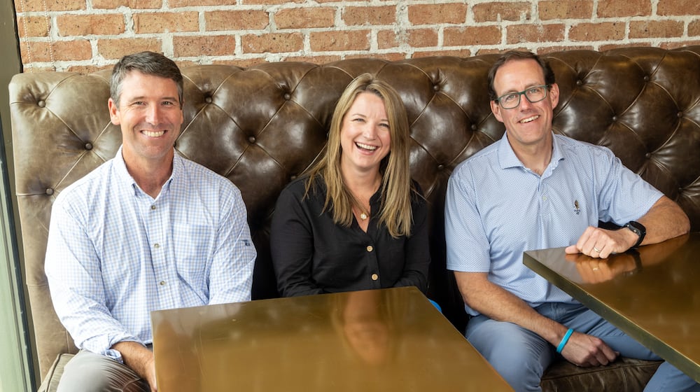 (Left to right) Wes Murrell, regional general superintendent, Jodi Taylor, chief HR officer and Greg Hunsberger, COO of planning & project delivery, are shown at the Brasfield & Gorrie offices in Atlanta. (Phil Skinner for the AJC)