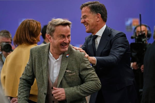 NATO Secretary-General Mark Rutte, right, talks to Luxembourg's Foreign Minister Xavier Bettel as they arrive for a group photo during a NATO's informal meeting of foreign ministers in Antalya, southern Turkey, Thursday, May 15, 2025. (AP Photo/Khalil Hamra)