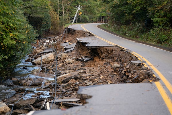 A partially collapsed road in the aftermath of Hurricane Helene in October 2024 near Black Mountain, N.C. (Sean Rayford/TNS 2024)