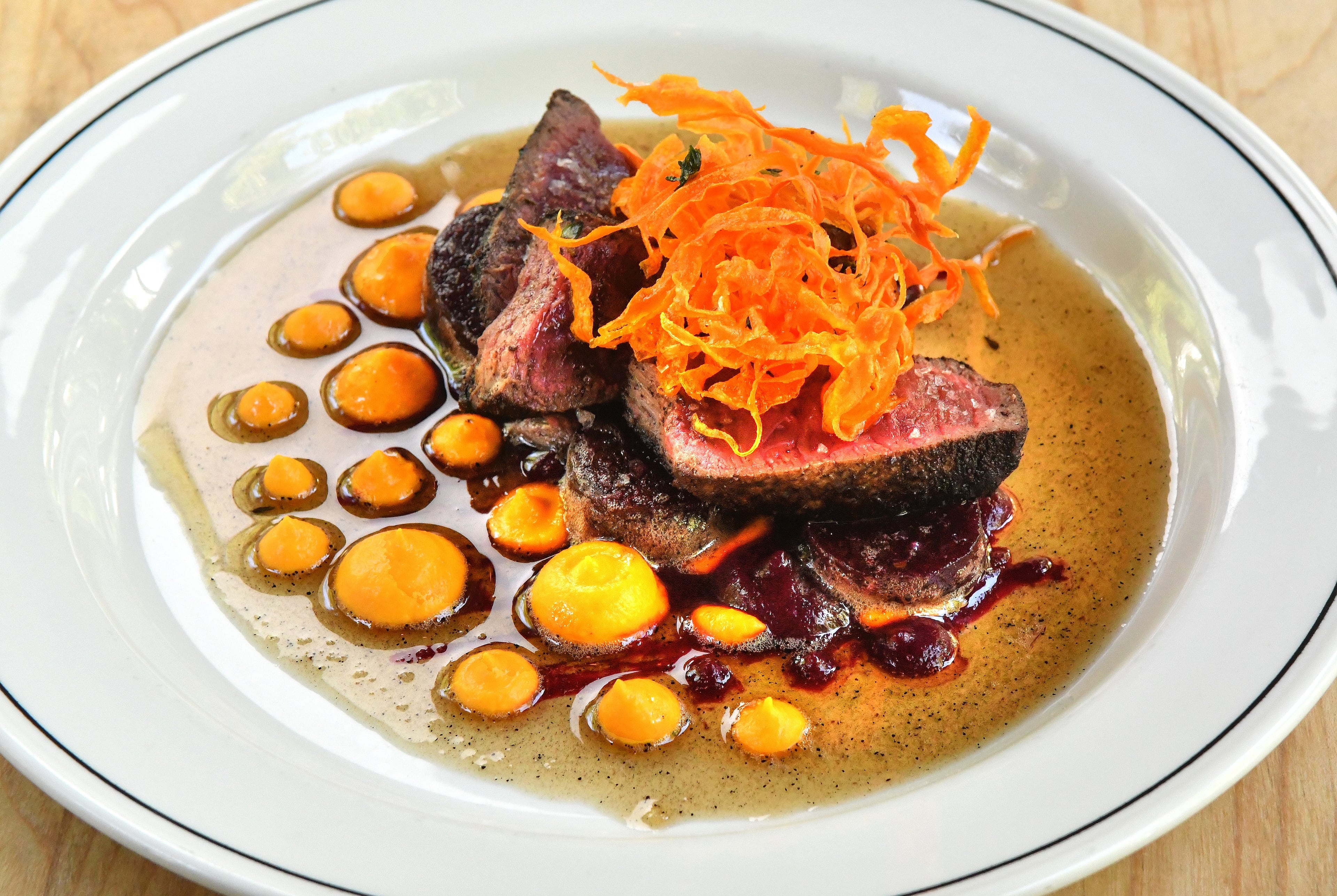 The Deer and the Dove in Decatur shines with an honest spirit, from the purity of ingredients, to the straightforward manner of preparation, like this Coffee-dusted Venison. (Chris Hunt for the AJC)