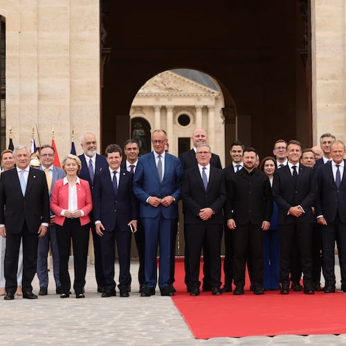 French President Emmanuel Macron and Ukrainian President Volodymyr Zelensky pose for a group photo with heads of states and governments ahead of the Coalition of the Willing summit on security guarantees for Ukraine at the Hotel des Invalides in Paris, France, Monday, July 13, 2026. (Teresa Suarez/POOL photo via AP)