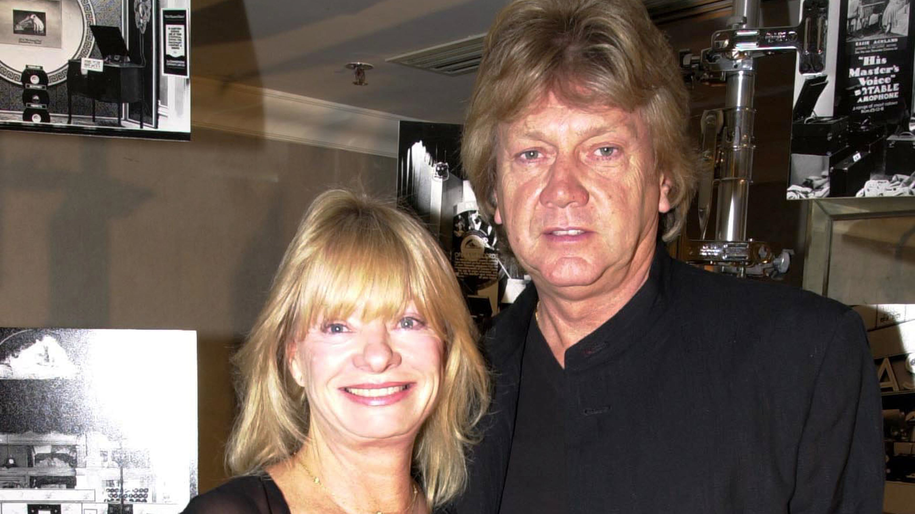 Moody Blues lead singer John Lodge and his wife arrive at the Grosvenor Hotel in London, Oct. 18, 2001. (Lionel Healing/PA via AP, file)