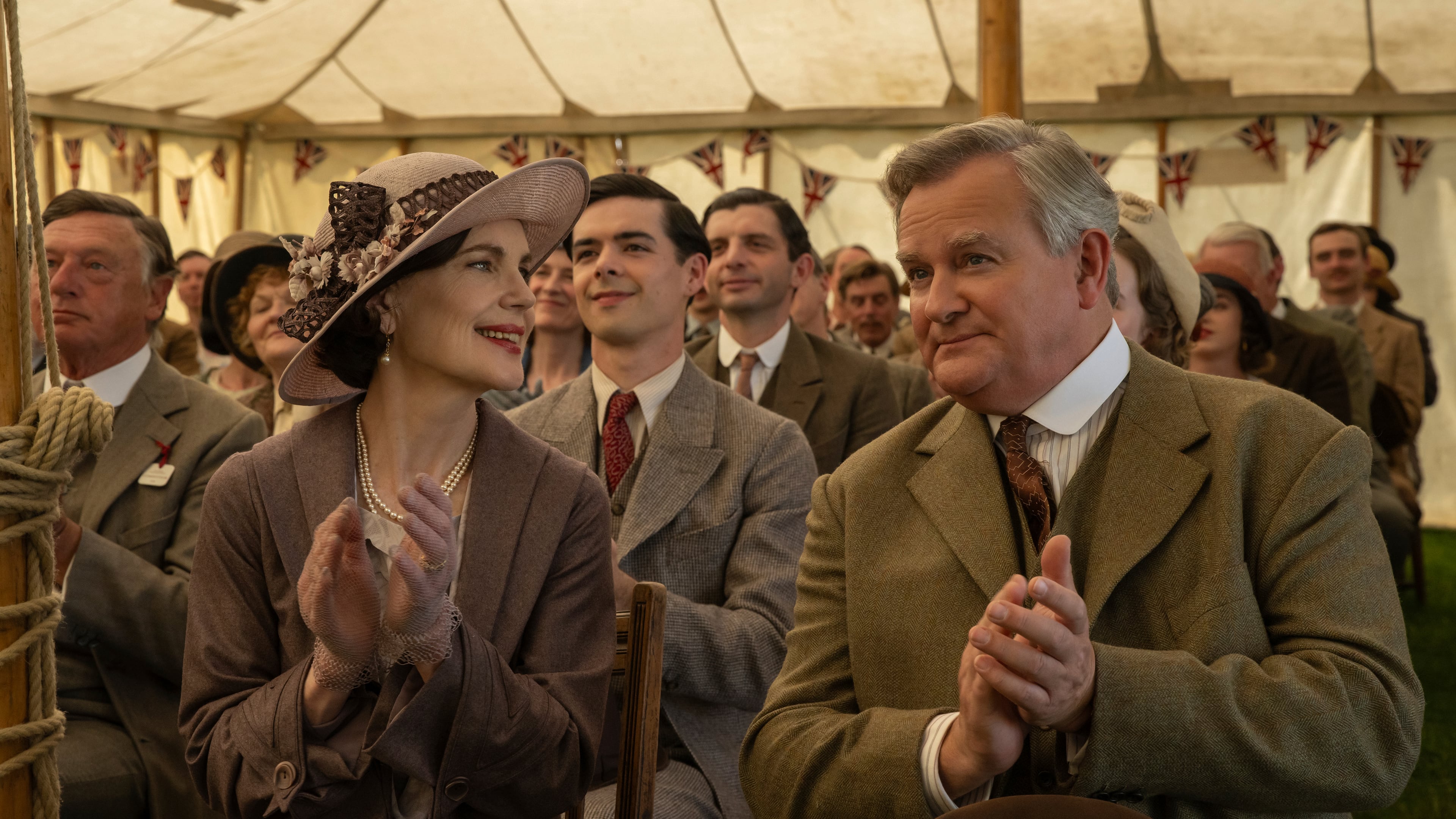 This image released by Focus Features shows Elizabeth McGovern, left, and Hugh Bonneville in a scene from "Downton Abbey: The Grand Finale." (Focus Feature via AP)