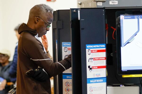 Stephen Knight voted at the Helene Mills Senior Center on Tuesday, Nov. 4, 2025. The top ballot includes races for the Public Service Commission, Atlanta mayor, and Atlanta City Council president, among others. (Miguel Martinez/ AJC)