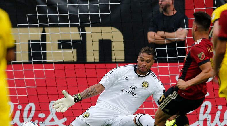 Atlanta United forward Hector Villalba (15) gets the ball past Columbus Crew goalkeeper Zack Steffen (23) for a goal in the first half of an MLS soccer match, Saturday, June 17, 2017, in Atlanta (AP Photo/John Bazemore)