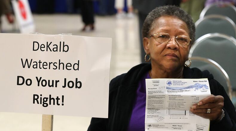 DeKalb resident Arelia Wimby, whose latest water bill is $2,845.08, was on hand with dozens of other area residents to demand answers about excessively high water bills during a town hall meeting at the Maloof Auditorium in Decatur on Nov. 10. Curtis Compton/ccompton@ajc.com