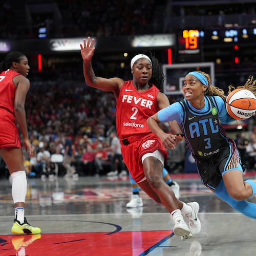 Atlanta Dream's Jordin Canada (right) goes to the basket against Indiana Fever's Aari McDonald during the first half of a WNBA basketball game on Friday, July 11, 2025, in Indianapolis. (AJ Mast/AP)