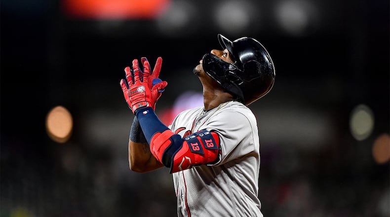 Braves left fielder Ronald Acuna celebrates after hitting a fifth inning single against the Colorado Rockies Monday, April 8, 2019, at Coors Field in Denver.