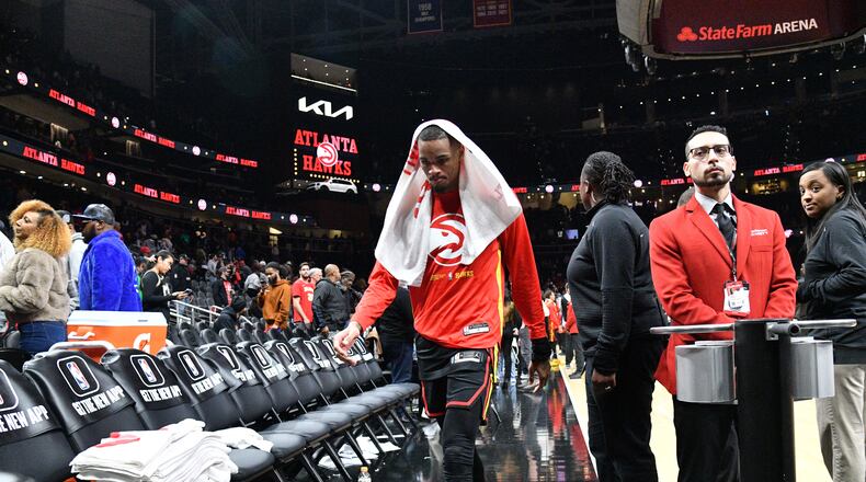 Hawks' guard Dejounte Murray (5) leaves the basketball court at State Farm Arena on Wednesday, November 16, 2022. (Hyosub Shin / Hyosub.Shin@ajc.com)
