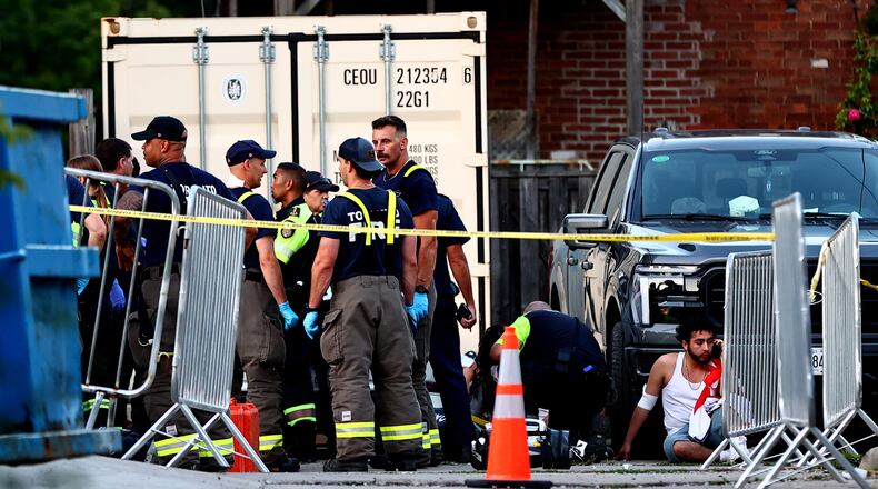 Paramedics respond to an active shooter at the Salsa on St. Clair event in Toronto, Saturday, July 11, 2026. (Keito Newman/The Canadian Press via AP)