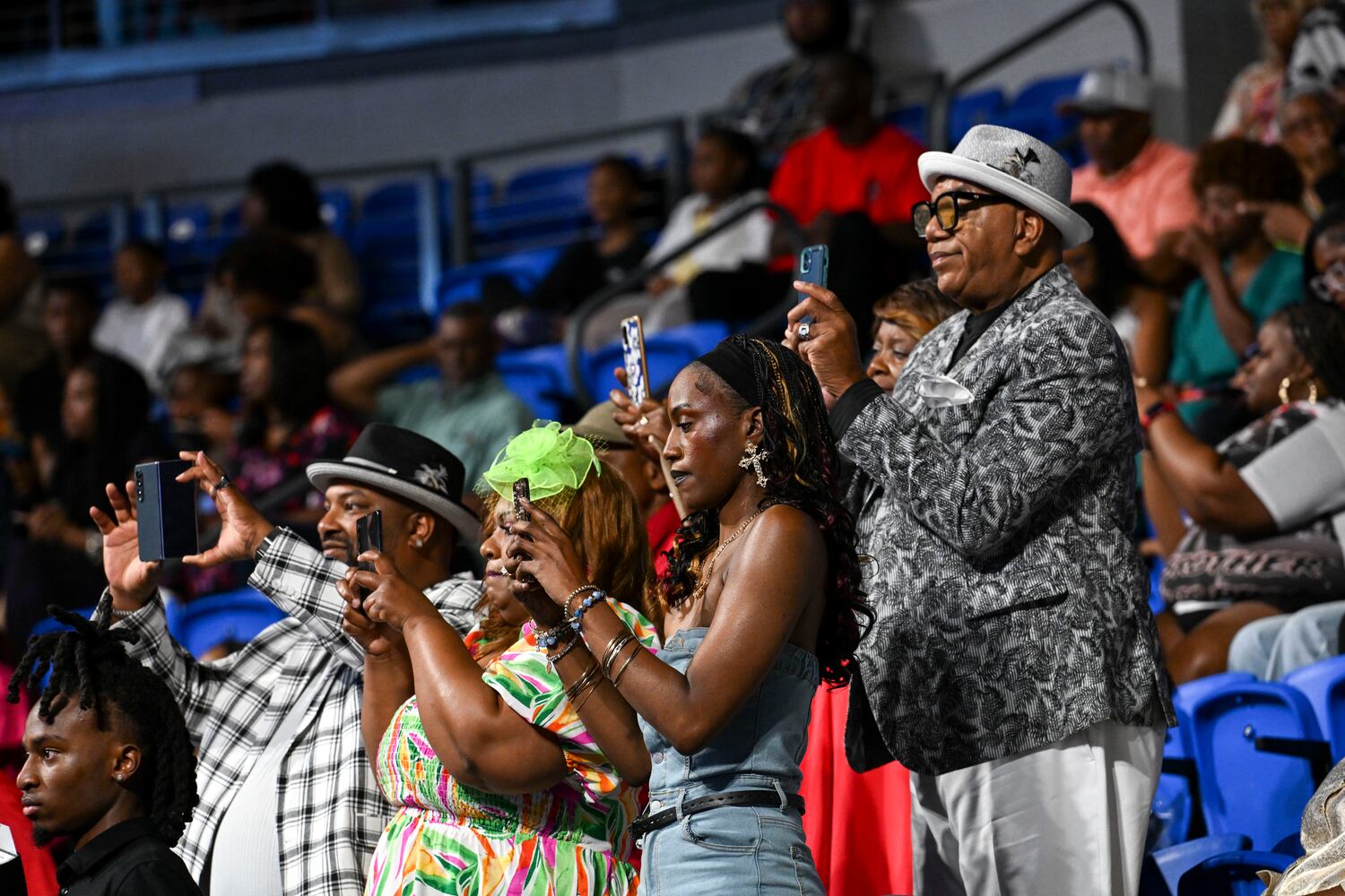 Friends a family snap photos of their graduates during Clark Atlanta University’s 2025 commencement ceremony Sunday, May 18, 2025 at Georgia State’s Convocation Center. (Daniel Varnado/For the Atlanta Journal-Constitution)