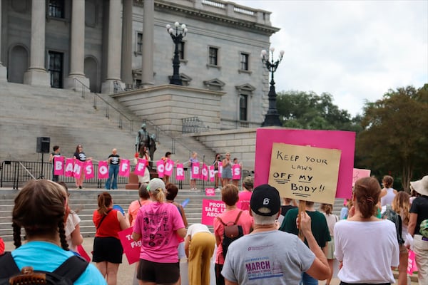 FILE - Protesters gather outside the state house in opposition to a proposed abortion ban debated Tuesday, Aug. 30, 2022 by the South Carolina House of Representatives in Columbia, S.C. (AP Photo/James Pollard, file)