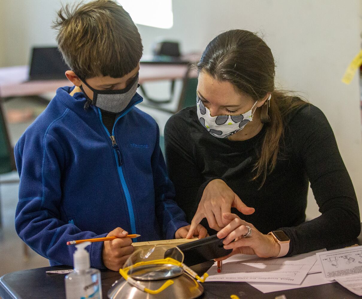 Cub Scouts building pinewood derby cars