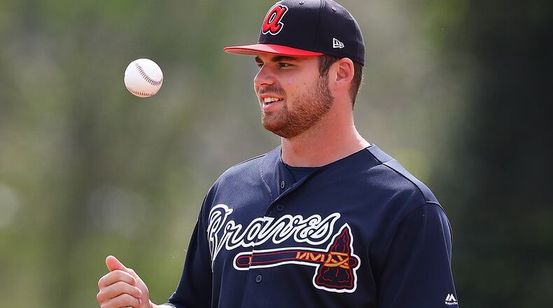 Braves pitcher Bryse Wilson participates in drills during the first full squad workout at spring training Thursday, Feb. 21, 2019, at the ESPN Wide World of Sports Complex in Lake Buena Vista, Fla.