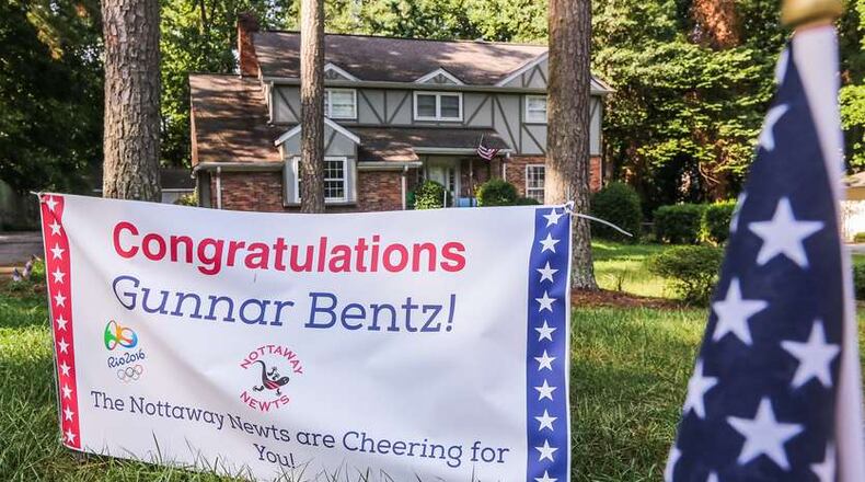 Signs welcome home U.S. Olympic swimmer Gunnar Bentz. Bentz, the first male swimmer in UGA history to win a gold medal in the Olympics, will return to Atlanta today. He was allowed to leave Brazil after being detained following a bogus robbery claim scandal. AJC photo: John Spink