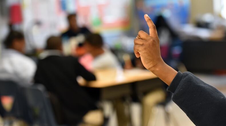 January 30, 2015 New Orleans, AL - A student raises his hand during his 5th grade science at KIPP Central City Academy in New Orleans, AL, on Friday, January 30, 2015. When Hurricane Katrina hit New Orleans, Louisiana decided to carry out a bold experiment - seize control of the city's worst schools, place them in a state-run "recovery" district and hand them over to charter operators. Ten years later, Georgia and a handful of other states want to replicate this approach, which has been heralded as a success among ed reformers. But is it really working? Fewer students are failing exams and grad rates up, but critics say it's far from a miracle. They point to tough discipline practices that bounce kids out of schools for minor infractions and fear the long-term implications of an all-charter approach. HYOSUB SHIN / HSHIN@AJC.COM New Orleans, La. - A student raises his hand during his 5th grade science class at KIPP Central City Academy in New Orleans. After Hurricane Katrina hit Louisiana decided to carry out a bold experiment – to seize control of the city's worst schools, place them in a state-run "recovery" district and hand them over to charter operators. Ten years later, Georgia and a handful of other states want to replicate this approach. Hyosub Shin, hshin@ajc.com