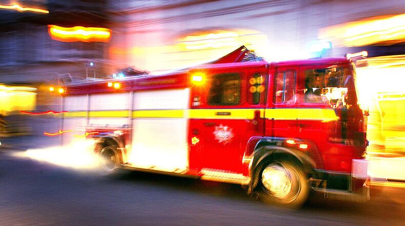 A fire truck races to an emergency call October 23, 2002, in London.