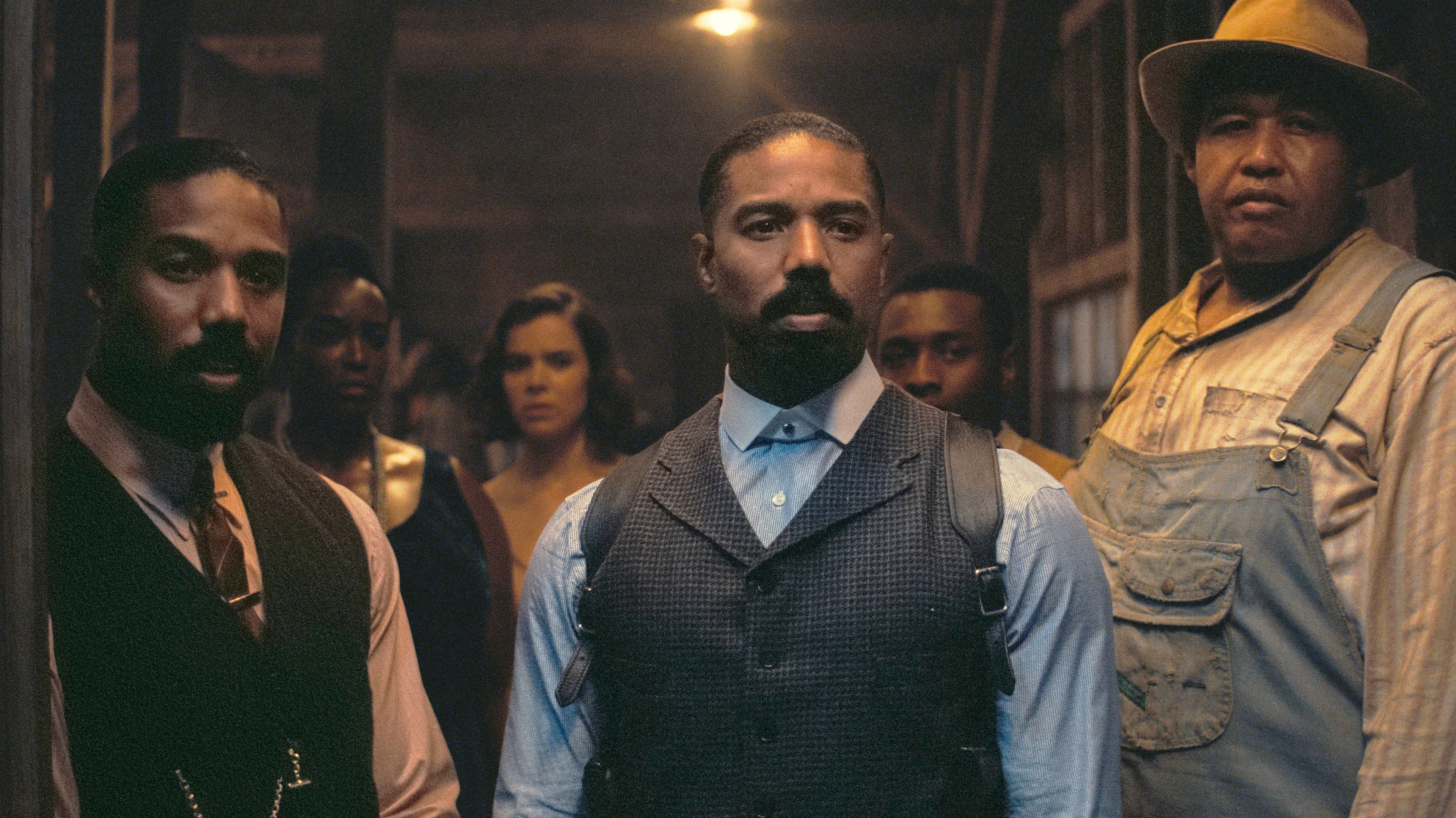 This image released by Warner Bros Pictures shows Michael B. Jordan, foreground from left, Michael B. Jordan and Omar Benson Miller in a scene from "Sinners." (Warner Bros. Pictures via AP)