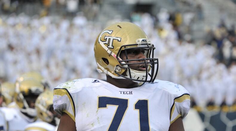 Georgia Tech Yellow Jackets offensive lineman Shamire Devine (71) watches from the sideline in the second half at Bobby Dodd Stadium on Saturday, November 1, 2014. Georgia Tech Yellow Jackets won 35-10 over the Virginia Cavaliers. HYOSUB SHIN / HSHIN@AJC.COM