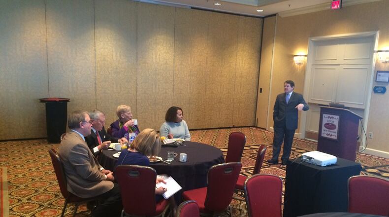 Gov. Nathan Deal, Superintendent Richard Woods and state Sen. Elena Parent listen to a presentation by former Louisiana Superintendent Paul Pastorek about the state's education overhaul this morning. (AJC/Greg Bluestein)