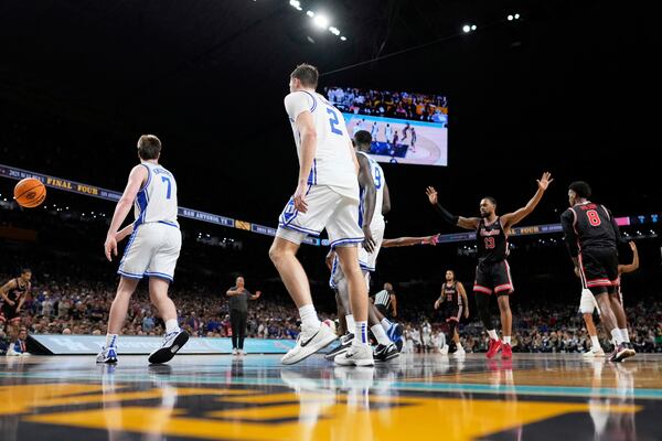 Houston forward J'Wan Roberts celebrates after making a free throw against the Duke late in the second half in the national semifinals at the Final Four of the NCAA college basketball tournament, Saturday, April 5, 2025, in San Antonio. (AP Photo/Brynn Anderson)