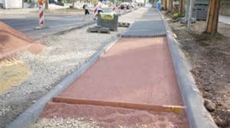 The sidewalk project could be completed before Christmas.