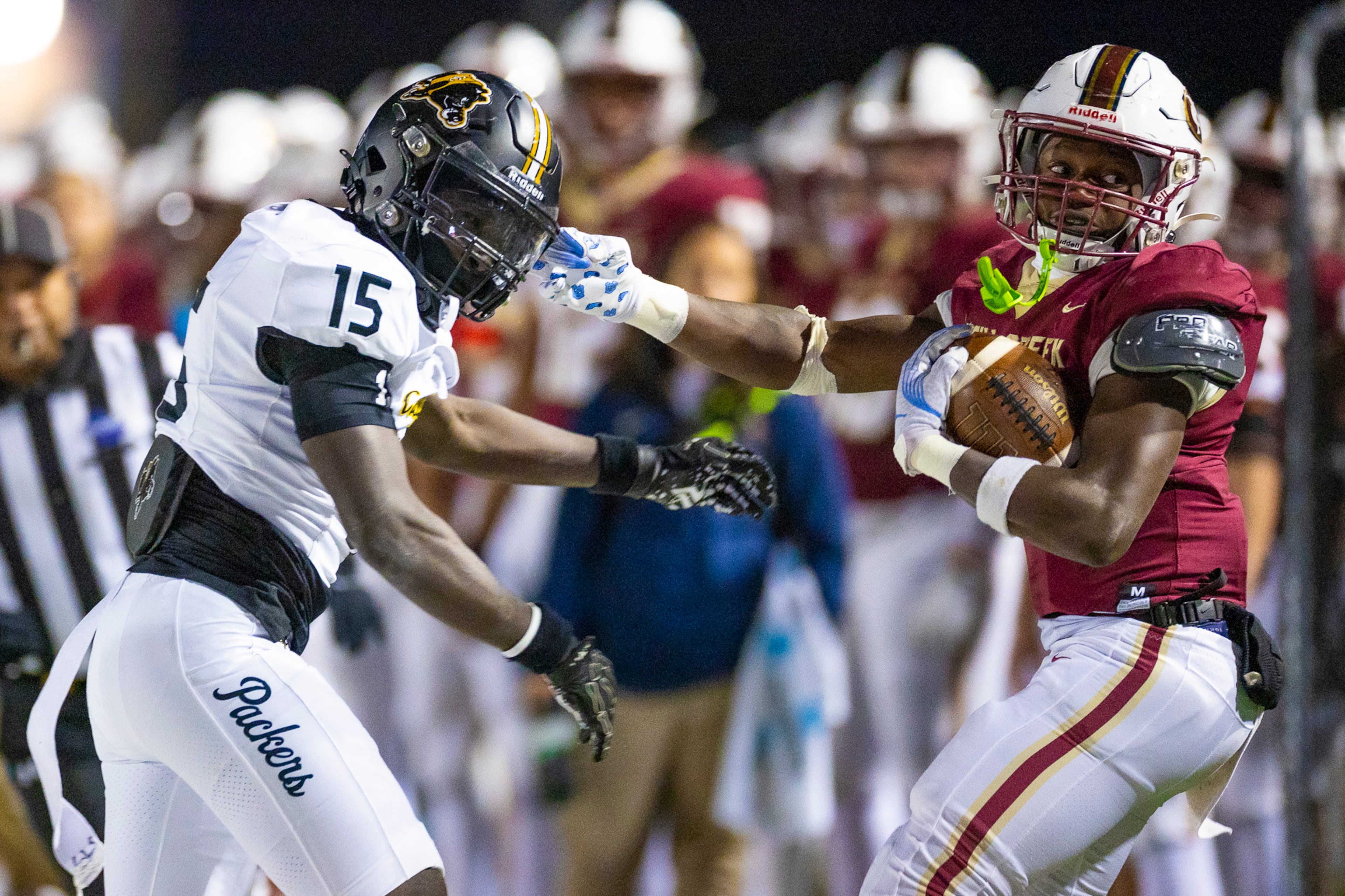 Mill Creek running back Jayde Beasley (2) runs against Colquitt County middle linebacker Davion Enoch (15) during the first half against Colquitt County at Mill Creek Community Stadium, Friday, Nov. 14, 2025, in Hoschton, Ga. (Oscar Guevara Saenz for the AJC)