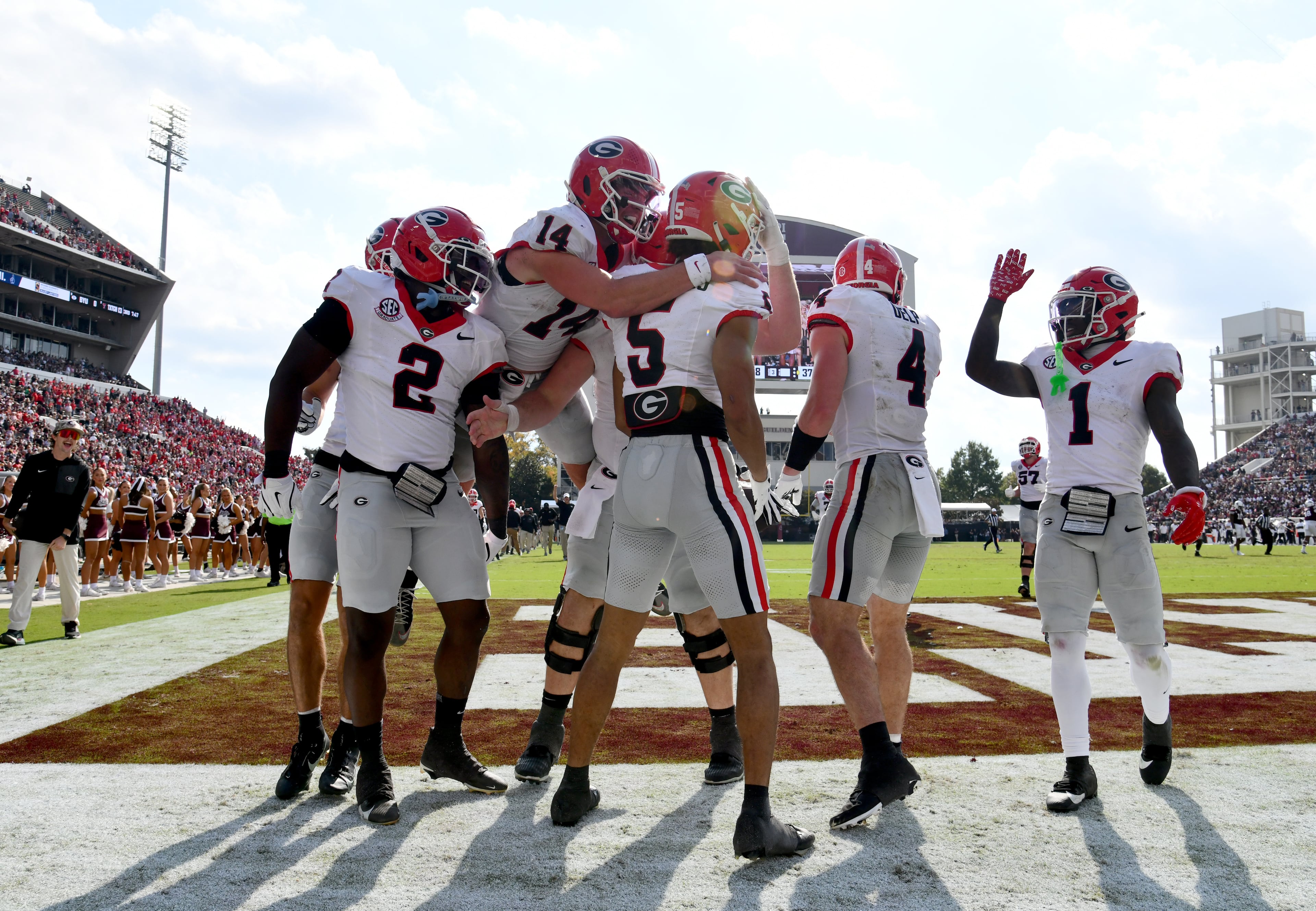 Georgia wide receiver Noah Thomas (5) celebrates with teammates after scoring a touchdown during the second half in an NCAA football game at Davis Wade Stadium, Saturday, November 8, 2025, in Starkville, Mississippi. Georgia won 41-21 over Mississippi State. (Hyosub Shin / AJC)