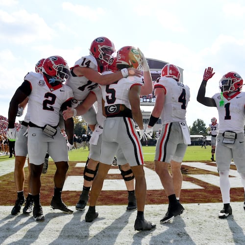 Georgia wide receiver Noah Thomas (5) celebrates with teammates after scoring a touchdown during the second half in an NCAA football game at Davis Wade Stadium, Saturday, November 8, 2025, in Starkville, Mississippi. Georgia won 41-21 over Mississippi State. (Hyosub Shin / AJC)