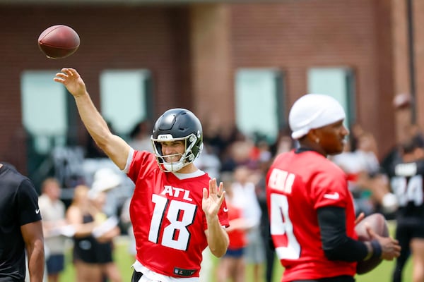 Atlanta Falcons quarterback Kirk Cousins (right) makes a pass as he works alongside quarterback Michael Penix Jr. during minicamp at the Atlanta Falcons Training Facility on Wednesday, June 11, 2025, in Flowery Branch, Ga.
(Miguel Martinez/AJC)
