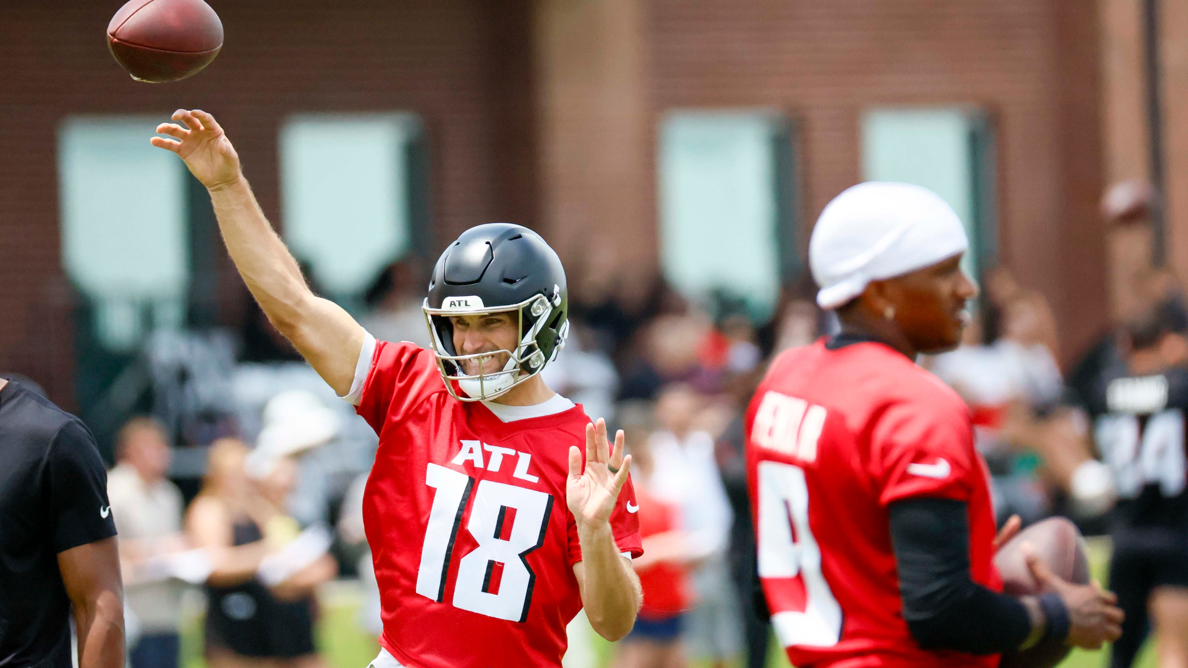 Falcons quarterback Kirk Cousins (left) says he was surprised when the team selected another quarterback with the No. 8 pick in the 2024 draft, after Cousins had signed a big free-agent contract. (Miguel Martinez/AJC)