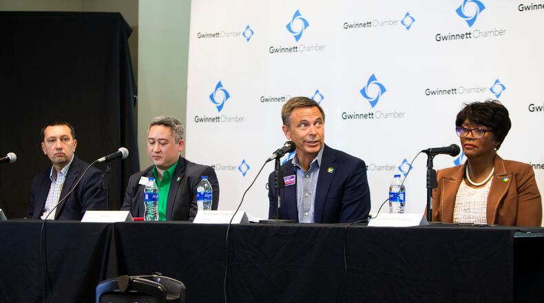 (Left to right) John Sabic, Ben Ku, Matthew Holkamp and Marlene Fosque participate in the Gwinnett Chamber of Commerce forum for county commission candidates on Thursday, October 6, 2022, at the Richard L. Tucker building in Duluth, Georgia. Masino, president & chief executive officer at the Gwinnett Chamber of Commerce, hosted the event in anticipation of the upcoming county commission election. CHRISTINA MATACOTTA FOR THE ATLANTA JOURNAL-CONSTITUTION.