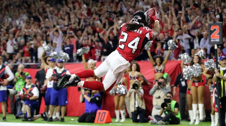 FEBRUARY 5, 2017 HOUSTON TX Atlanta Falcons running back Devonta Freeman (24) dives into the end zone for a score in the first quarter as the Atlanta Falcons meet the New England Patriots in Super Bowl LI at NRG Stadium in Houston, TX, Sunday, February 5, 2017. Curtis Compton/AJC