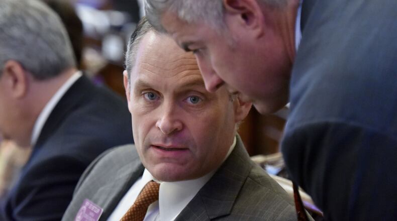 March 29, 2019 Atlanta - Rep. Ed Setzler (left) and Rep. Kevin Cooke confer during the 38th day of legislation in the House Chambers at the Georgia State Capitol on Friday, March 29, 2019. HYOSUB SHIN / HSHIN@AJC.COM