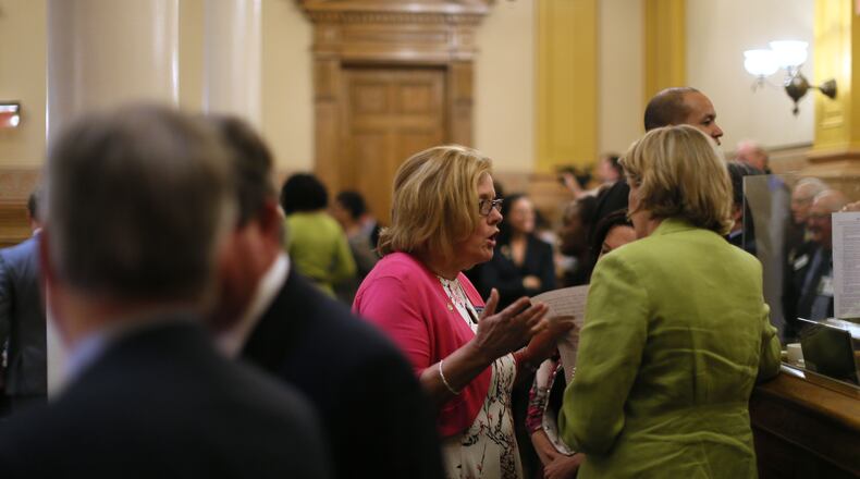 State Sen. Renee S Unterman (left) confers with House Speaker Pro-Tempore Jan Jones on Thursday night. An amendment was negotiated to allow the rape kit legislation that had passed in the House but blocked in the Senate by Unterman. Ultimately, the Senate approved it. Bob Andres, bandres@ajc.com