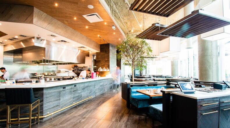 Ian Winslade, chef and partner at Mission + Market in Buckhead, says they budget roughly an hour and 45 minutes per reservation, giving themselves about 15 minutes of buffer between parties. (Henri Hollis/AJC 2018)