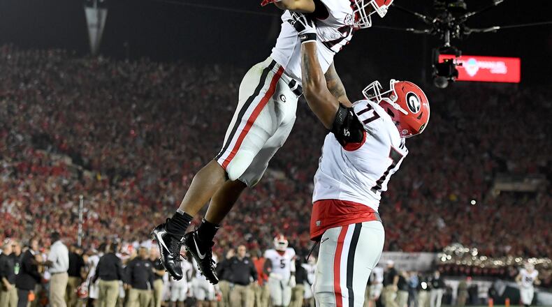 PASADENA, CA - JANUARY 01: Nick Chubb #27 of the Georgia Bulldogs and Isaiah Wynn #77 celebrate after Chubb scores a touchdown in the 2018 College Football Playoff Semifinal Game against the Oklahoma Sooners at the Rose Bowl Game presented by Northwestern Mutual at the Rose Bowl on January 1, 2018 in Pasadena, California. (Photo by Matthew Stockman/Getty Images)