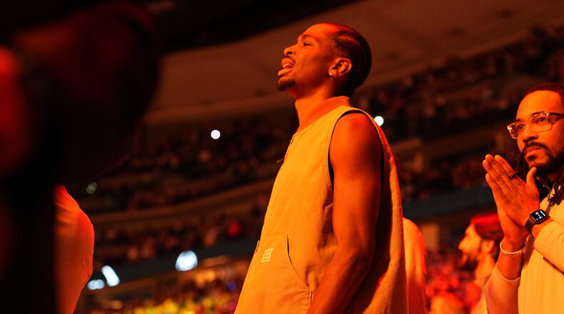 Oklahoma City Thunder guard Shai Gilgeous-Alexander looks on in street clothes during player introductions before the first half of an NBA basketball game against the Denver Nuggets Friday, April 10, 2026, in Denver. (AP Photo/David Zalubowski)