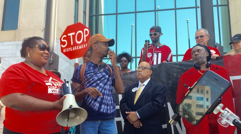 Avery Jackson, center, a member of Rise Up Georgia and Atlanta Black Students United, speaks during a rally by the Housing Justice League for new policies to expand and protect affordable housing in Atlanta. J. Scott Trubey/strubey@ajc.com
