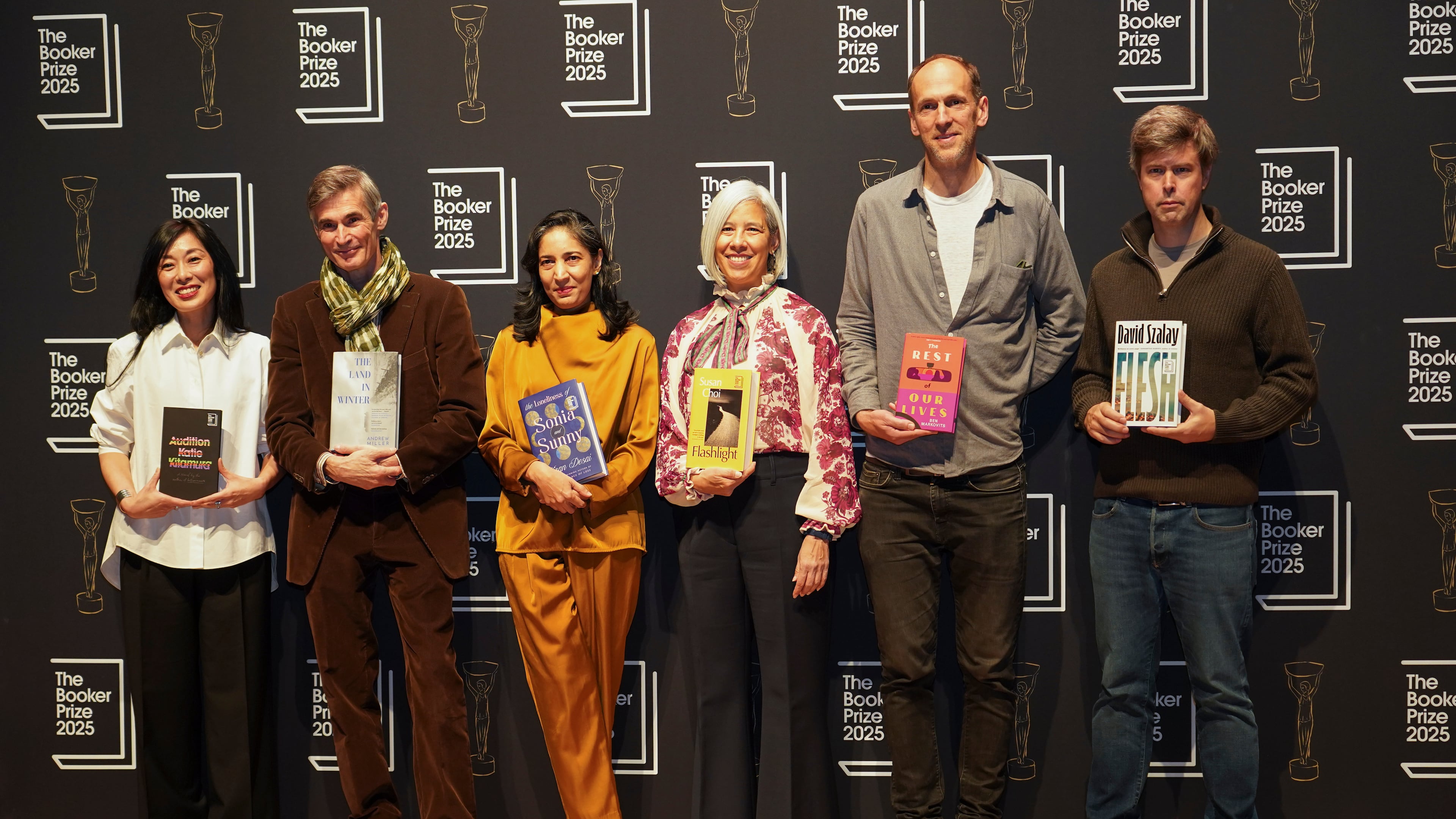 The 6 shortlisted authors pose for photographs during a photocall for the Booker Prize, in London, Sunday, Nov. 9, 2025. (AP Photo/Alberto Pezzali)
