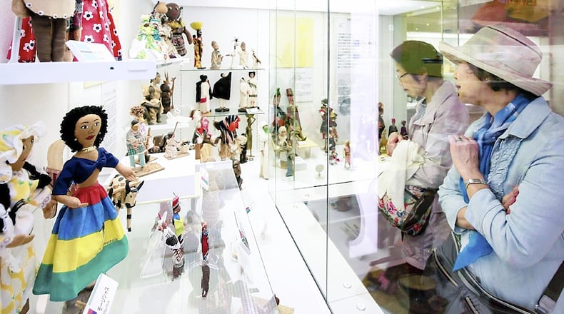 Visitors to the Yokohama Doll Museum look at dolls on display. PHOTO: Taku Yaginuma-The Yomiuri Shimbun