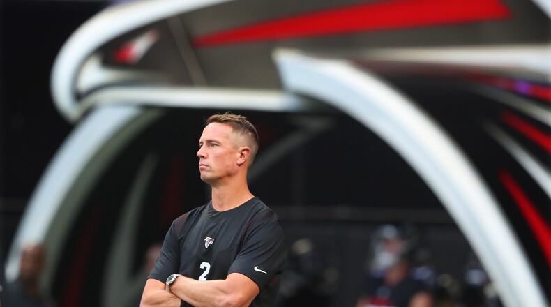 081321 Atlanta: Atlanta Falcons quarterback Matt Ryan, apparently not playing against the Tennessee Titans, watches teammates warmup for a NFL preseason football game on Friday, August 13, 2021, in Atlanta.   “Curtis Compton / Curtis.Compton@ajc.com”
