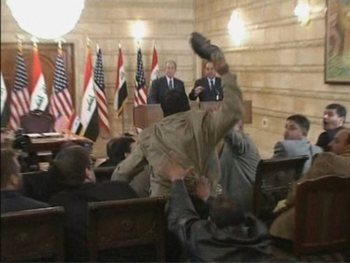 Man throws shoes at Bush
