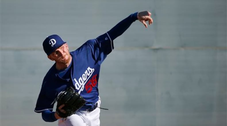 Los Angeles Dodgers' J.P. Howell throws a pitch during a spring training baseball workout Monday, Feb. 22, 2016, in Glendale, Ariz. (AP Photo/Ross D. Franklin)