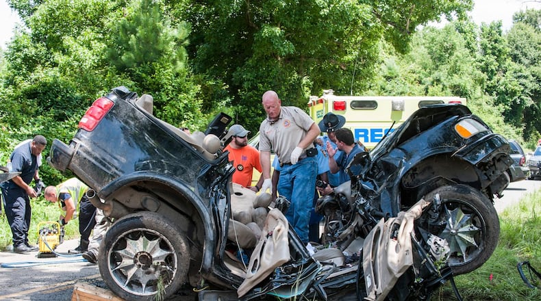 Officers investigate the scene of a single vehicle wreck on Webster Road just north of Quitman Tuesday morning. The wreck claimed the lives of three Brooks County football players; Jicarre Watkins, Johnny Parker and Shawn Waters. A fourth occupant, De'Vron Whitfield, also a Brooks football player was life-flighted to Shands Hospital.