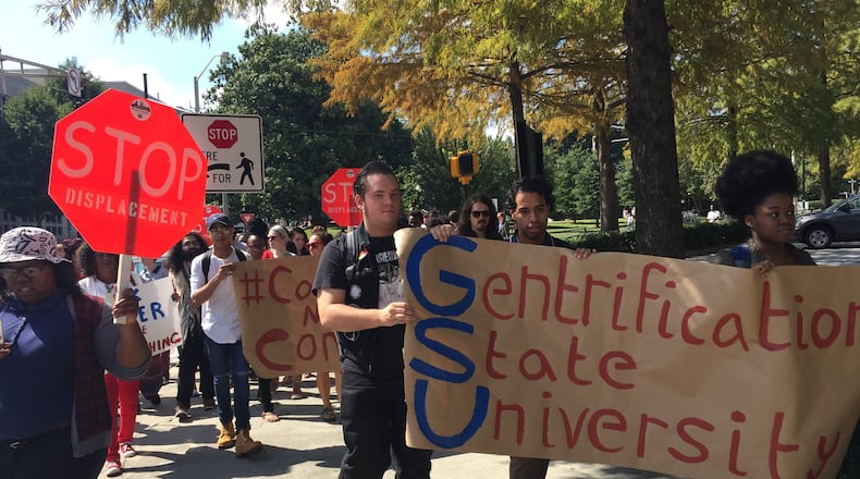 Georgia State University students and residents of neighborhoods near Turner Field stage a march on Tuesday to the downtown school’s Centennial Hall. They sought to meet GSU president Mark Becker to demand a seat at the table in discussions about redeveloping the area around the former home of the Atlanta Braves. LEON STAFFORD/ LSTAFFORD@AJC.COM